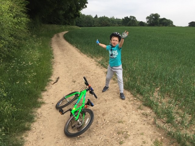 James cycling across the field