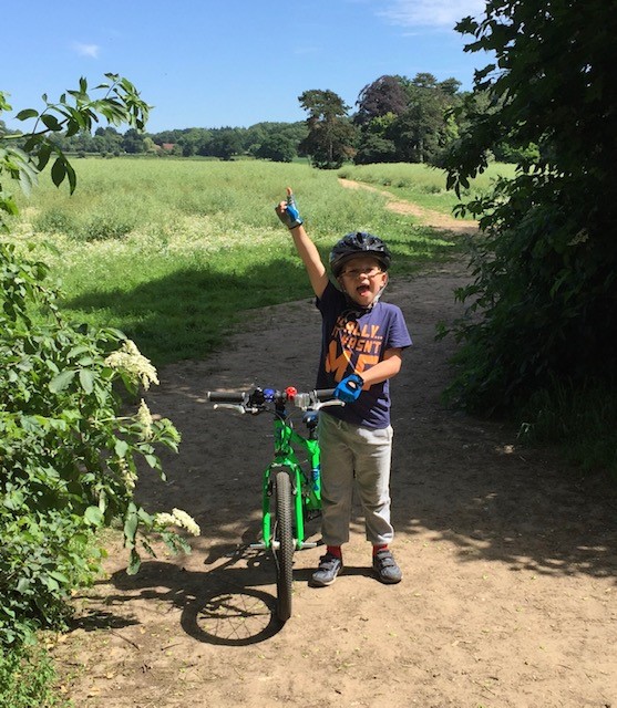 James on bike in a field