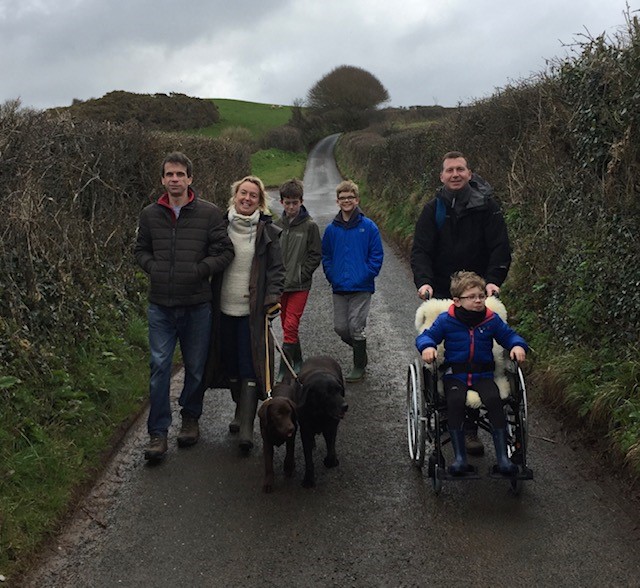 Family walking down a lane