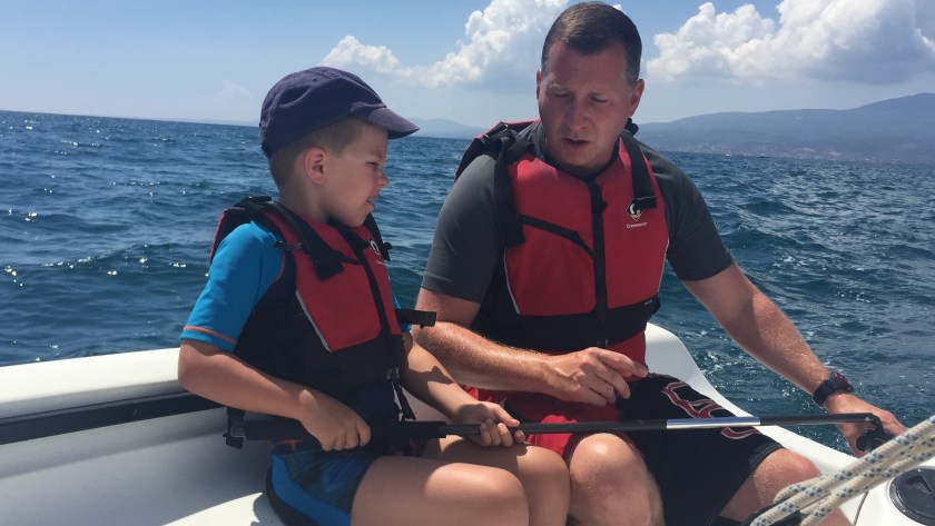 Howard showing James how to sail