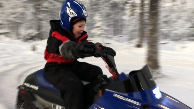 James on a mini ski-doo
